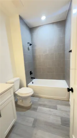 a bathroom with a toilet a sink and a bathtub