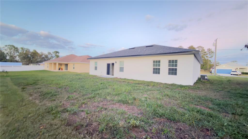 13047 Southwest 79th Circle Ocala, FL 34473 - Photo 29 of 29 a view of a house with backyard