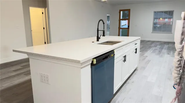 a room with sink and mirror