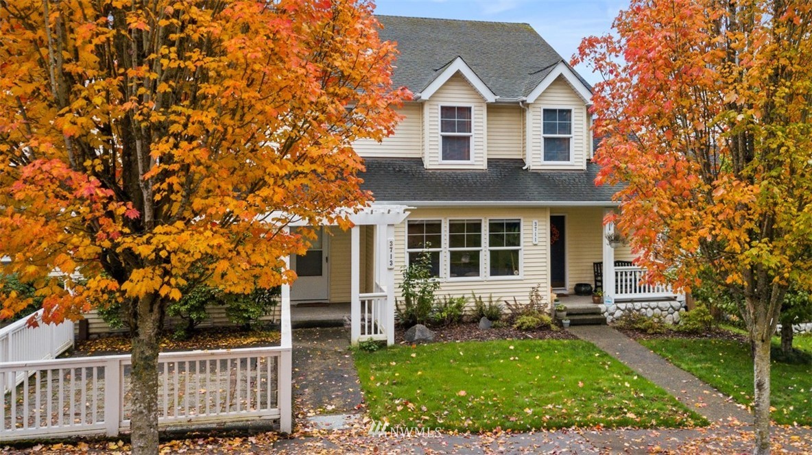 3711 Northeast 6th Street Renton, WA 98056 - Photo 1 of 20 a front view of a house with garden
