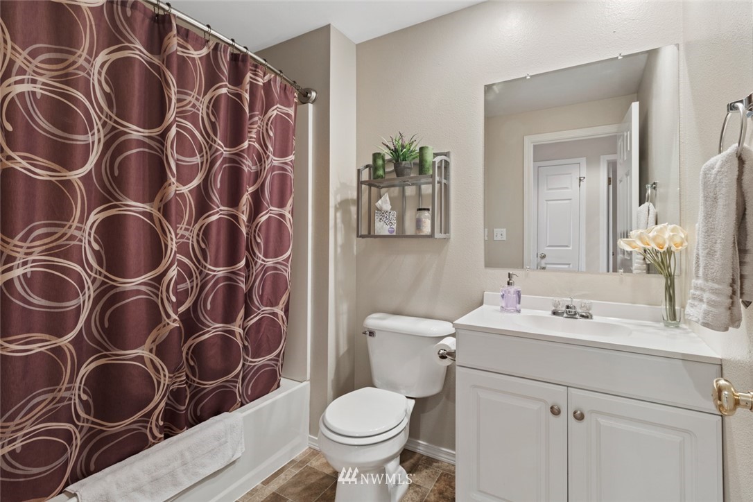 3711 Northeast 6th Street Renton, WA 98056 - Photo 13 of 20 a bathroom with a toilet sink and mirror