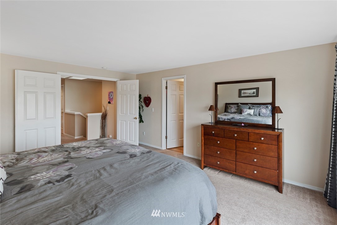 3711 Northeast 6th Street Renton, WA 98056 - Photo 16 of 20 a bedroom with a bed and a dresser in it