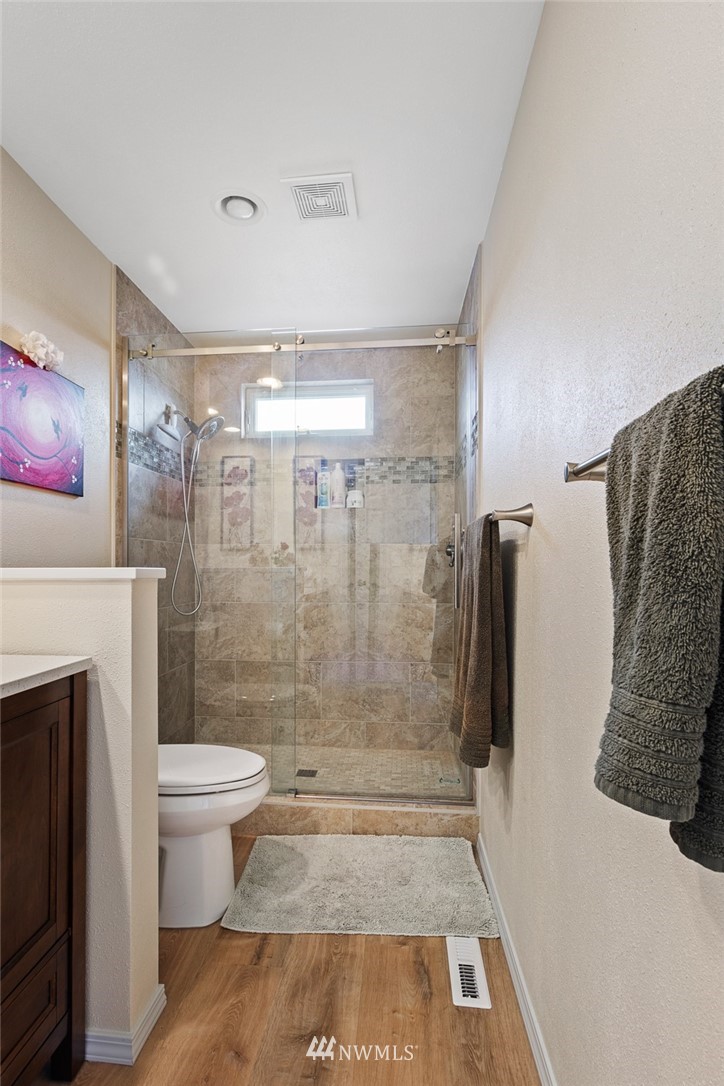 3711 Northeast 6th Street Renton, WA 98056 - Photo 18 of 20 a bathroom with a shower and a toilet