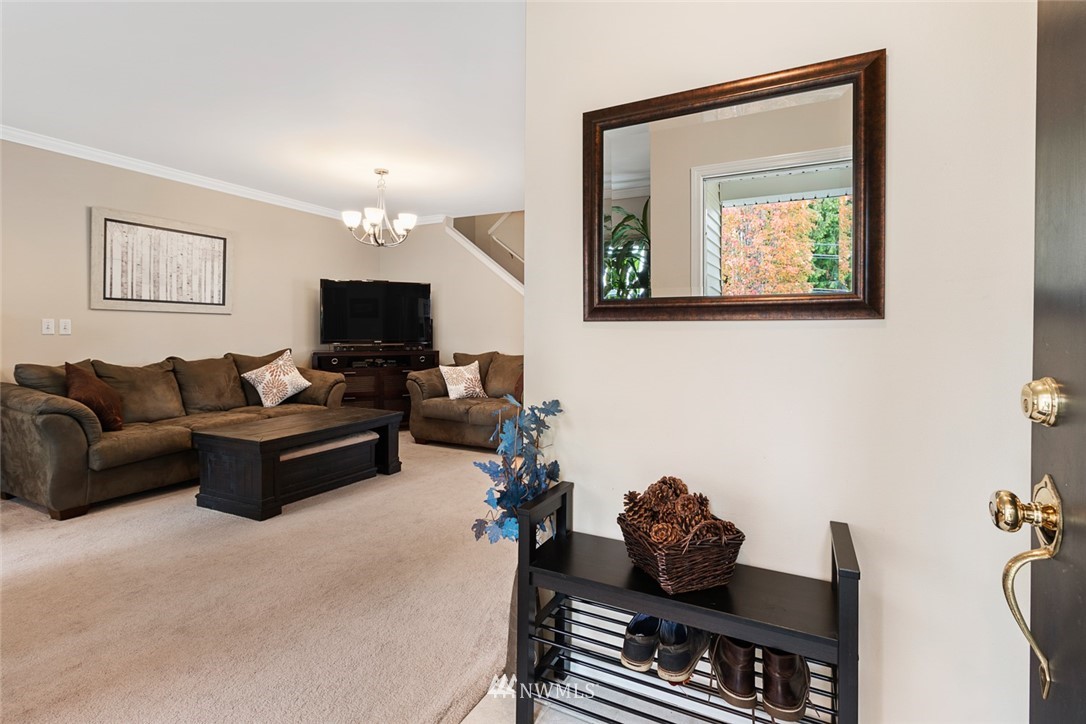 3711 Northeast 6th Street Renton, WA 98056 - Photo 3 of 20 a living room with furniture and a flat screen tv