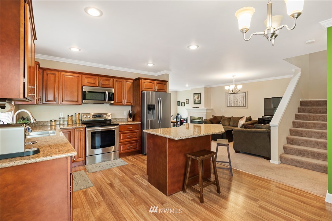 3711 Northeast 6th Street Renton, WA 98056 - Photo 9 of 20 a large kitchen with lots of counter space a sink and appliances