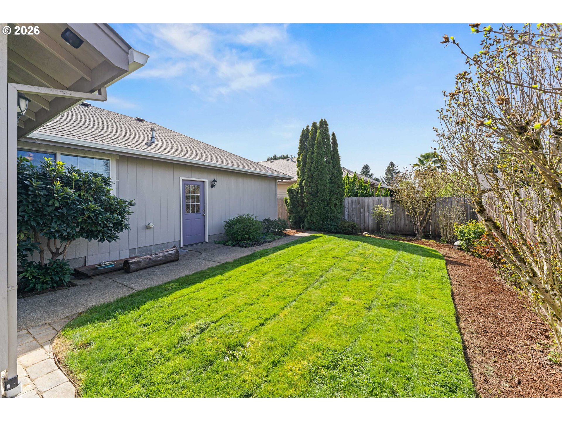 2188 Marie Drive Grants Pass, OR 97526 - Photo 25 of 27 a view of a backyard with plants and large tree