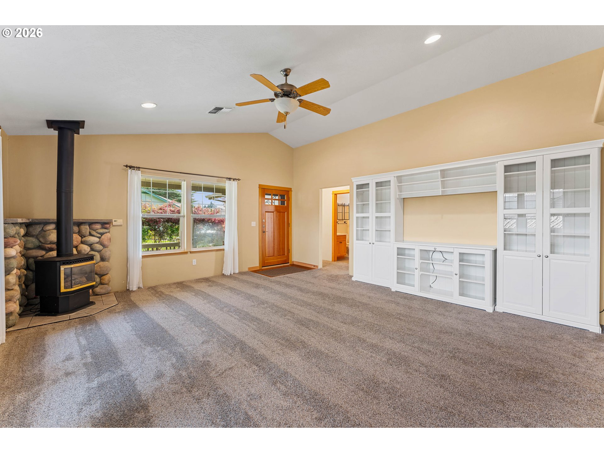 2188 Marie Drive Grants Pass, OR 97526 - Photo 7 of 27 a view of empty room with wooden floor and fan
