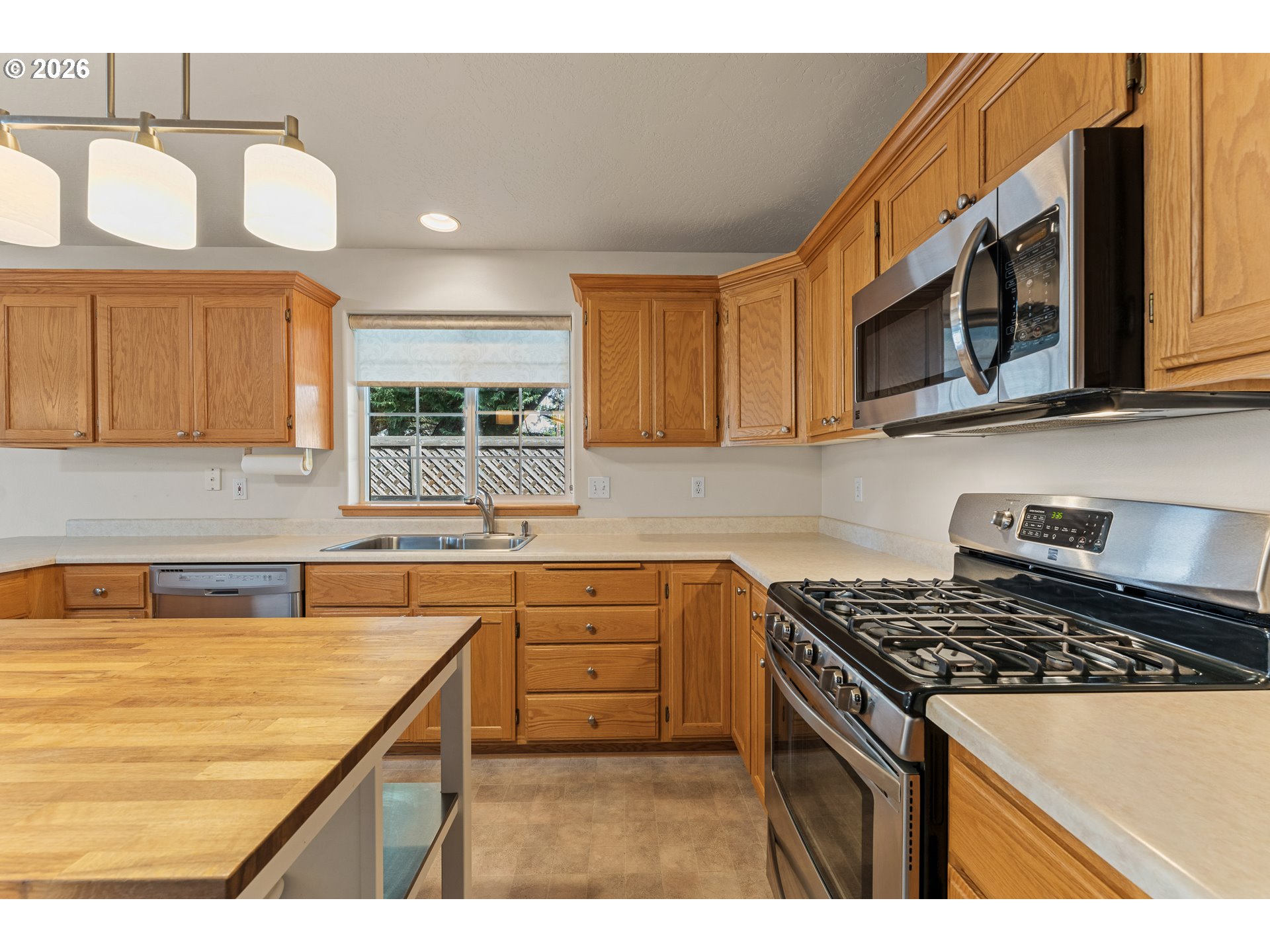 2188 Marie Drive Grants Pass, OR 97526 - Photo 10 of 27 a kitchen with stainless steel appliances granite countertop a sink and a stove