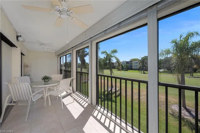 a view of a balcony with furniture