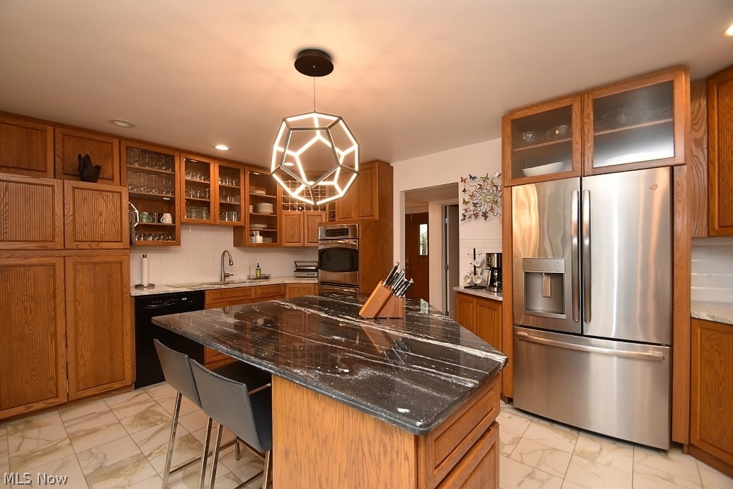 12632 Cedar Road Cleveland Heights, OH 44106 - Photo 4 of 29 Updated Kitchen with two sinks, an island, double ovens, induction countertop range and built-in microwave.