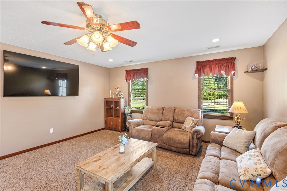 3411 Spring Run Road Mechanicsville, VA 23111 - Photo 25 of 41 a living room with furniture and a flat screen tv