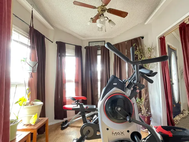 a view of a bedroom with washer and dryer