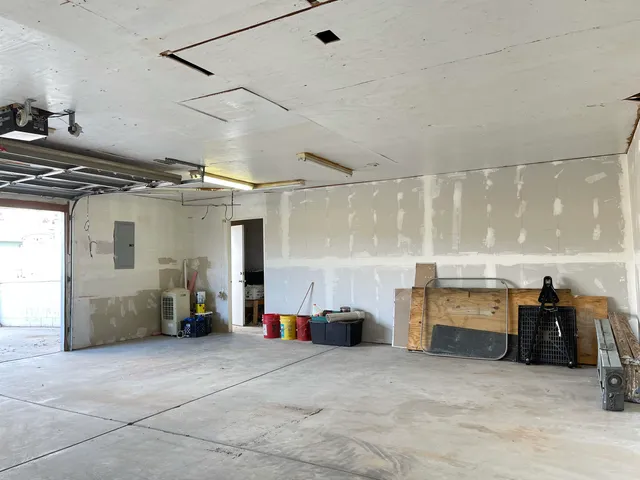 a view of a balcony with furniture and wooden floor