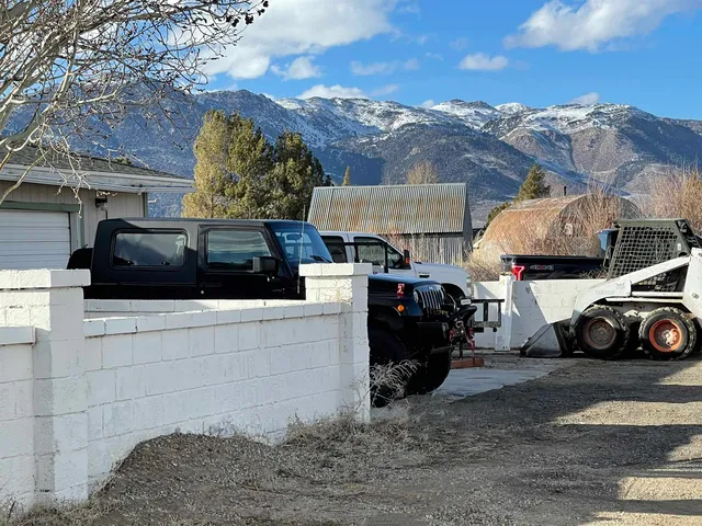a view of a house with large trees