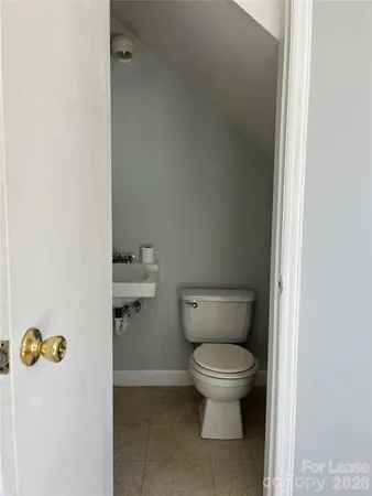 a bathroom with a blue toilet