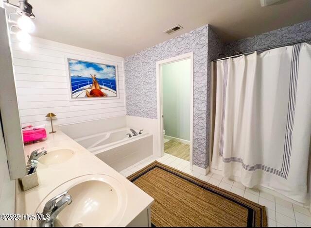 413 Commerce Avenue, Unit D Morehead City, NC 28557 - Photo 18 of 22 Master bedroom with whirlpool tub and separate shower