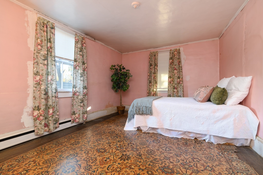 30 Puritan Road Weymouth, MA 02189 - Photo 11 of 34 a bedroom with a bed and a window