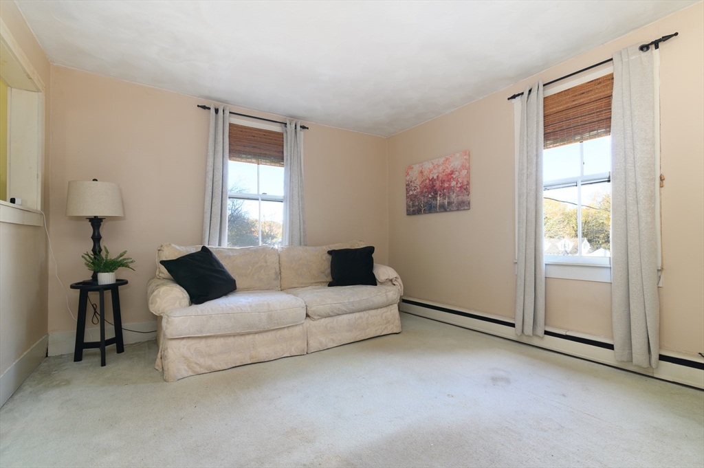 30 Puritan Road Weymouth, MA 02189 - Photo 15 of 34 a living room with furniture and a window