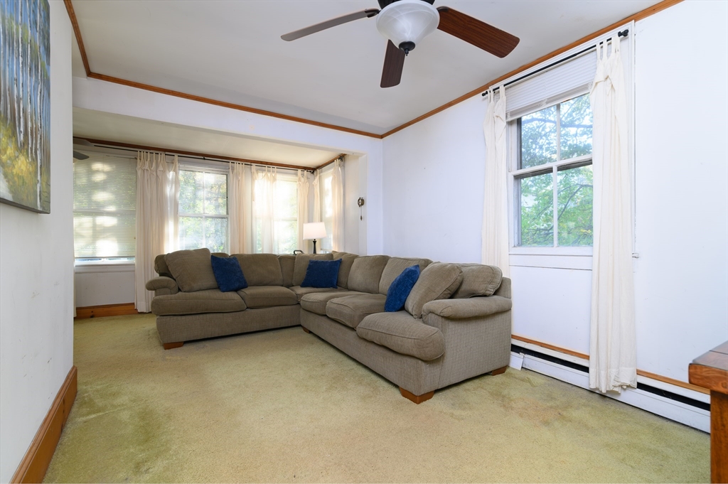 30 Puritan Road Weymouth, MA 02189 - Photo 18 of 34 a living room with furniture and a window