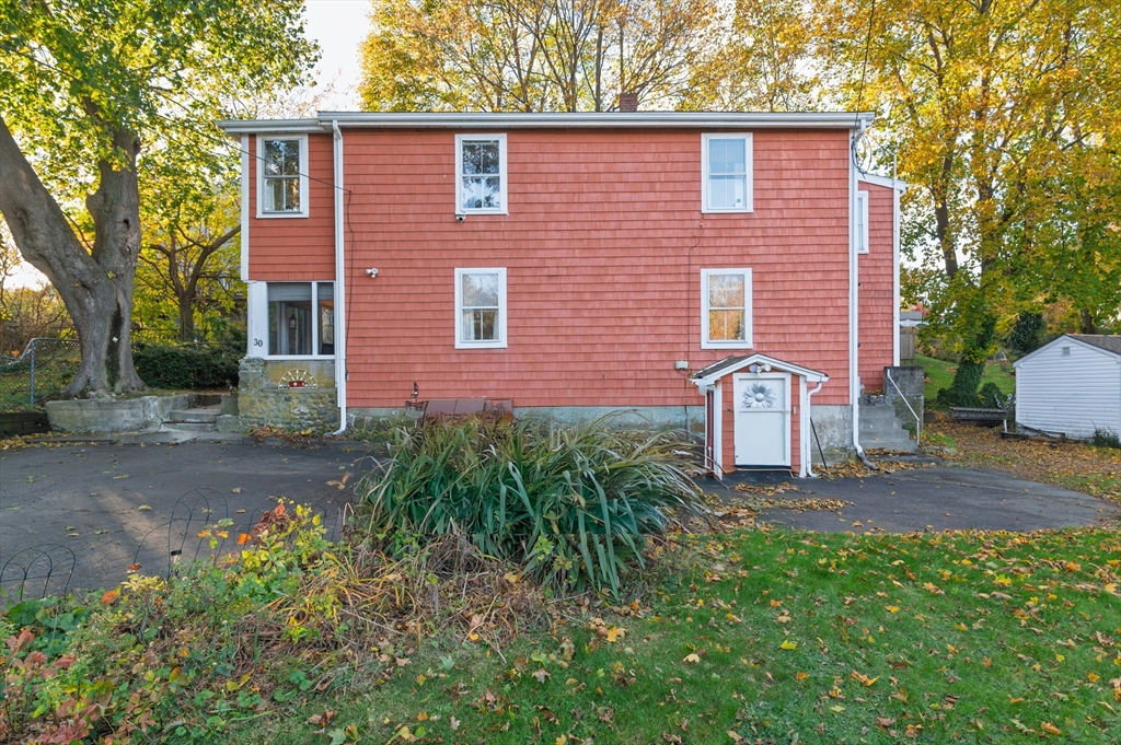 30 Puritan Road Weymouth, MA 02189 - Photo 5 of 34 a front view of a house with garden