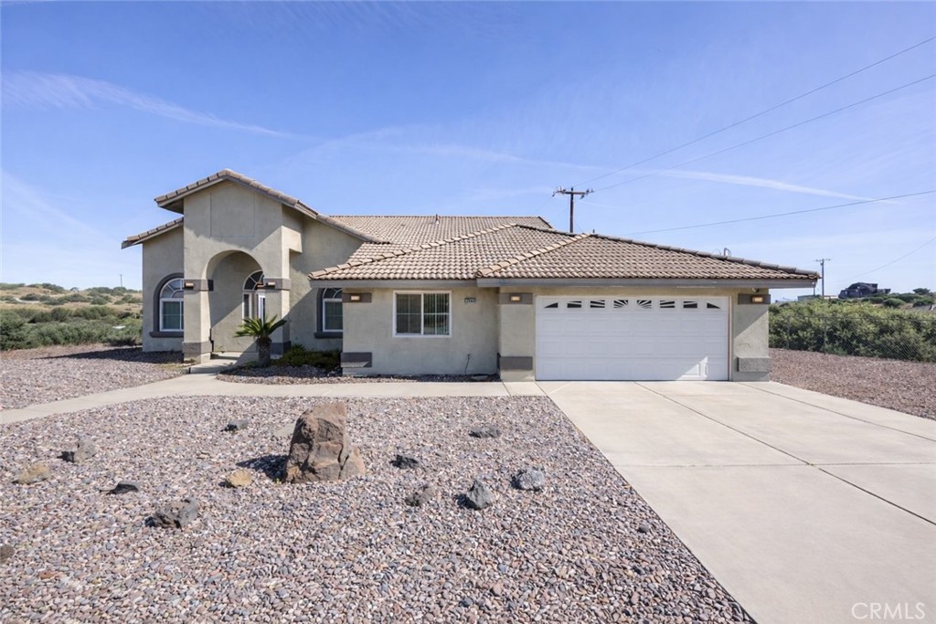 7084 Aster Road Oak Hills, CA 92344 - Photo 1 of 34 Front Home - Virtually Enhanced