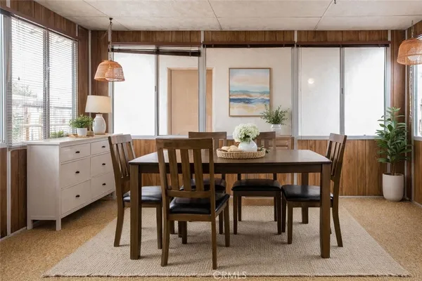 a dining room with furniture and window