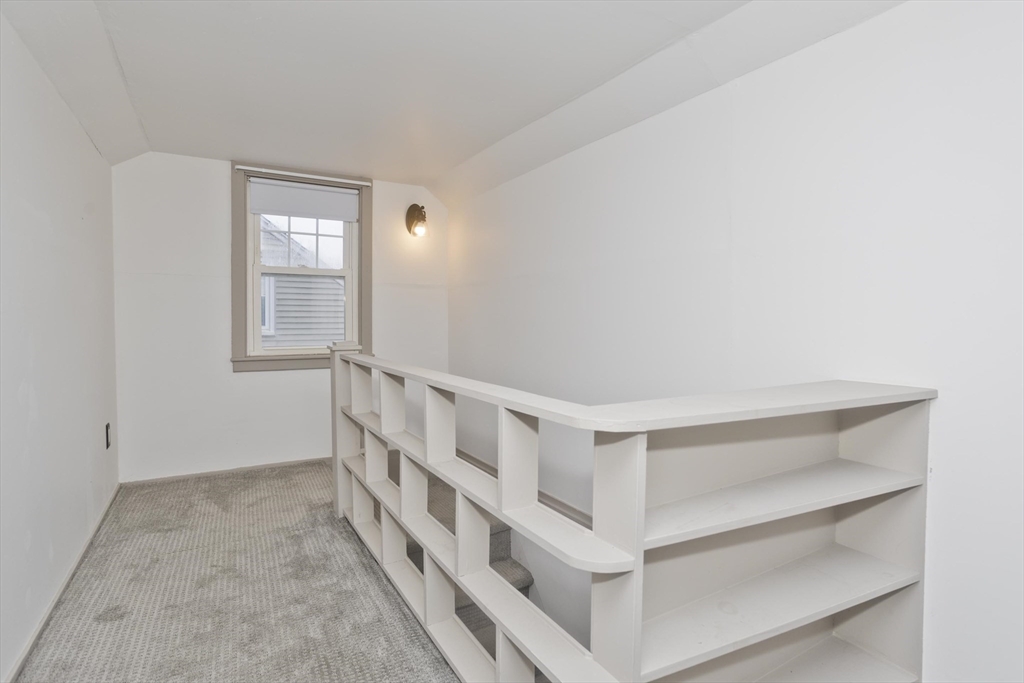 154 Ellsworth Avenue Springfield, MA 01118 - Photo 14 of 22 a view of an empty room and staircase