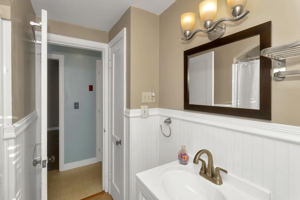 154 Ellsworth Avenue Springfield, MA 01118 - Photo 18 of 22 a bathroom with a sink and a mirror
