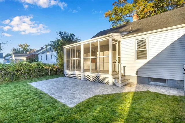 a view of backyard with a garden and deck