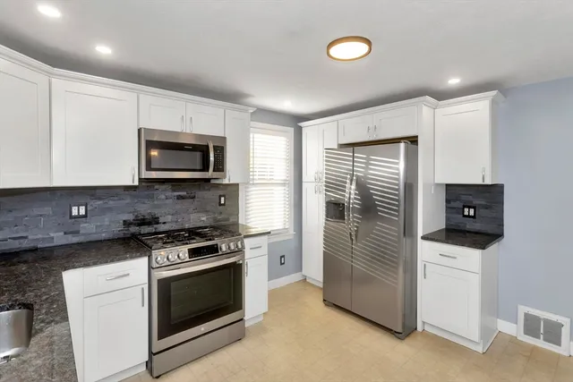 a kitchen with a stove and a microwave