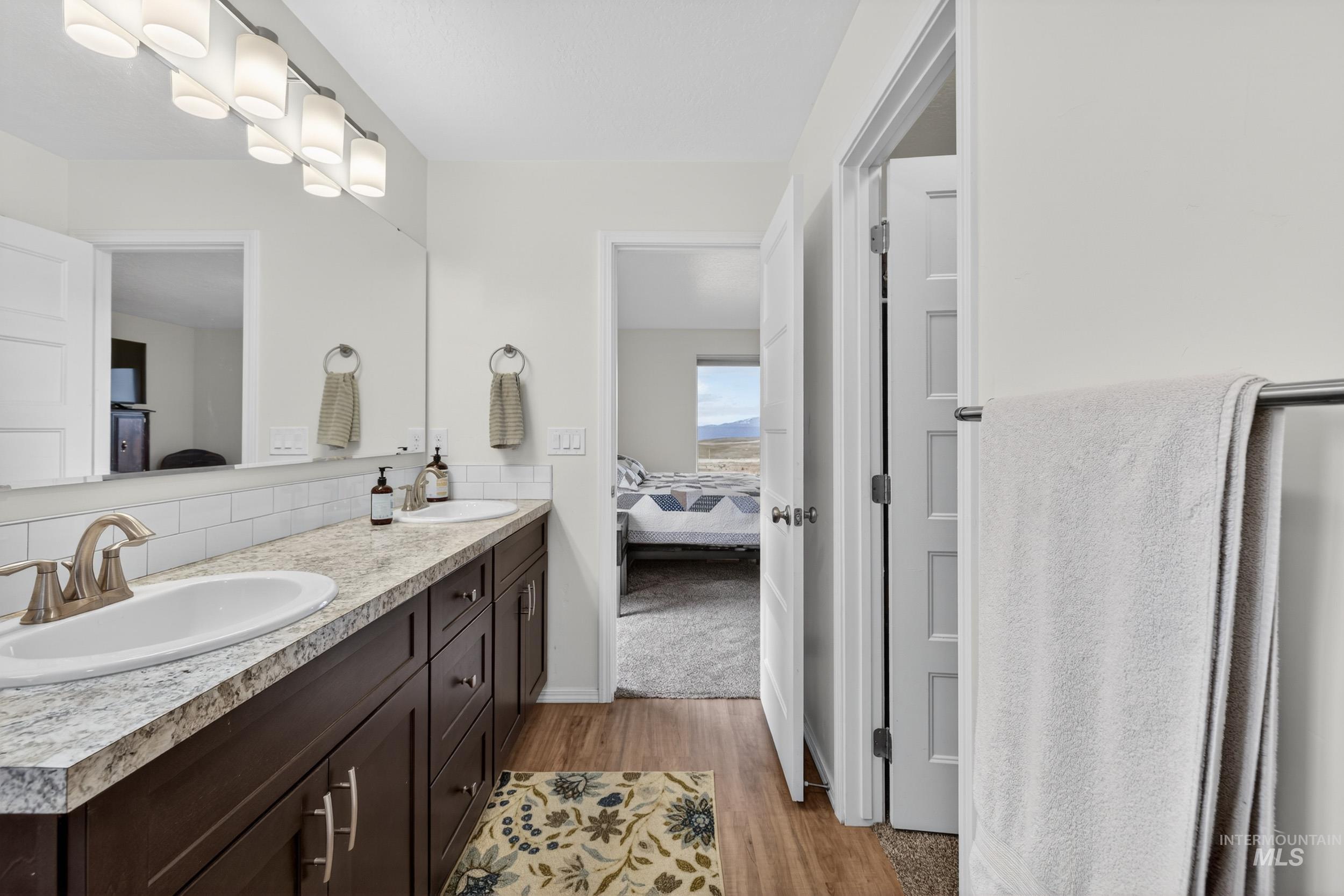 1854 Jacks Road Midvale, ID 83645 - Photo 6 of 16 Full bathroom featuring ensuite bathroom, double vanity, and light wood finished floors