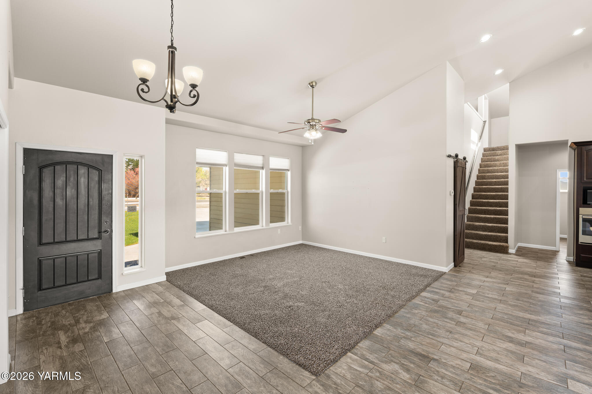 11625 Missimer Road Prosser, WA 99350 - Photo 11 of 40 a view of an empty room with a window and wooden floor