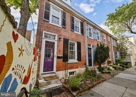 a front view of a building with street view
