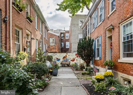 a view of a pathway both side of the house
