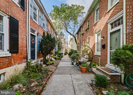 a view of a pathway with a house in the background