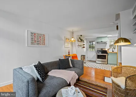 a living room with furniture and a table