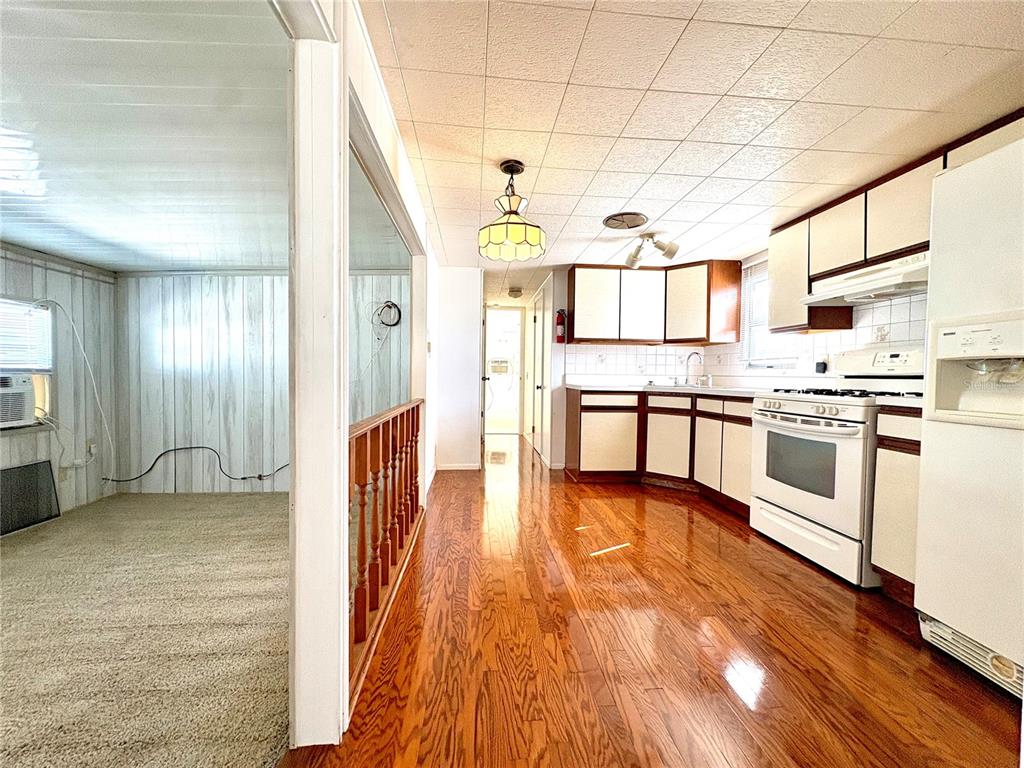 440 Denice Drive Seminole, FL 33772 - Photo 13 of 40 a view of a kitchen with a sink and cabinets