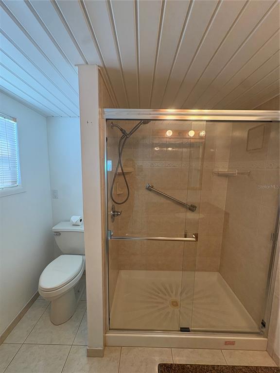 440 Denice Drive Seminole, FL 33772 - Photo 23 of 40 a bathroom with a toilet and a shower