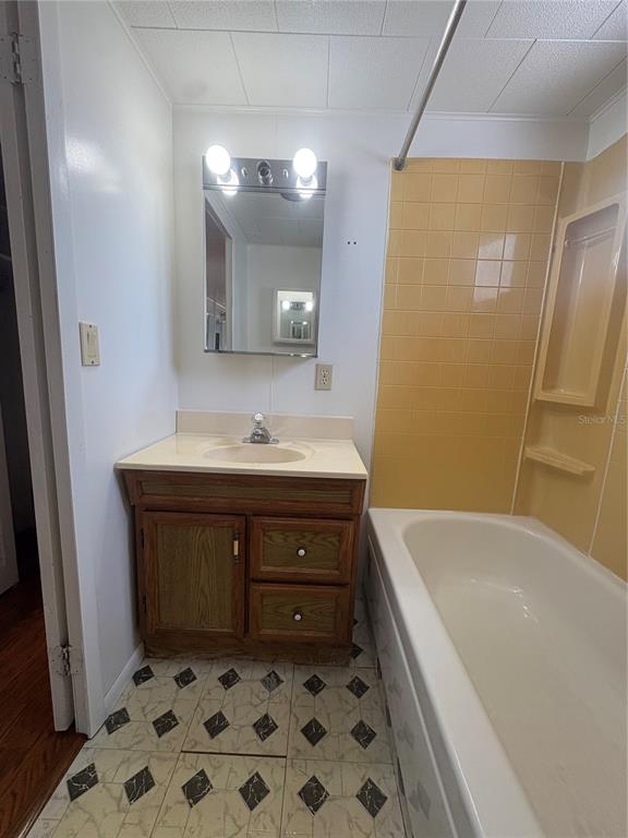 440 Denice Drive Seminole, FL 33772 - Photo 28 of 40 a bathroom with a tub sink and mirror