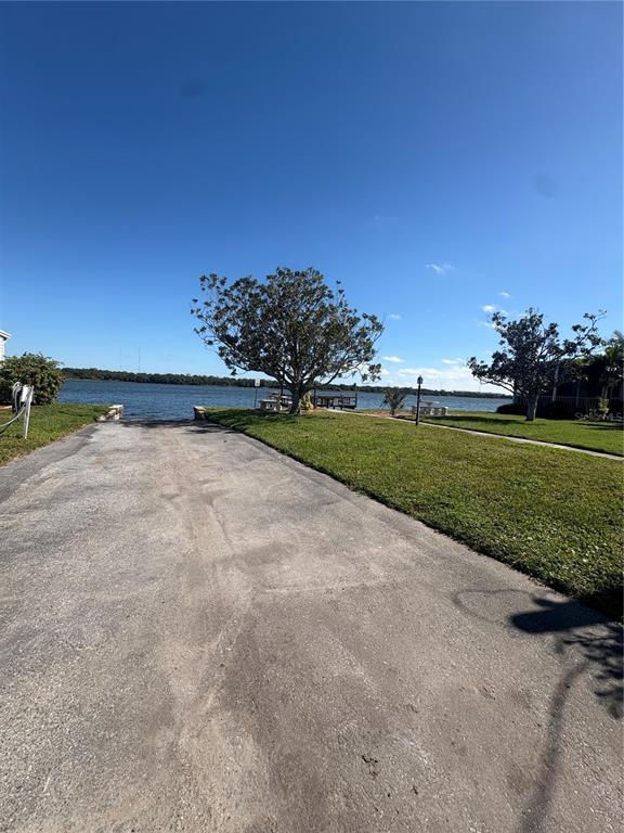 440 Denice Drive Seminole, FL 33772 - Photo 36 of 40 a view of a golf course with a lake