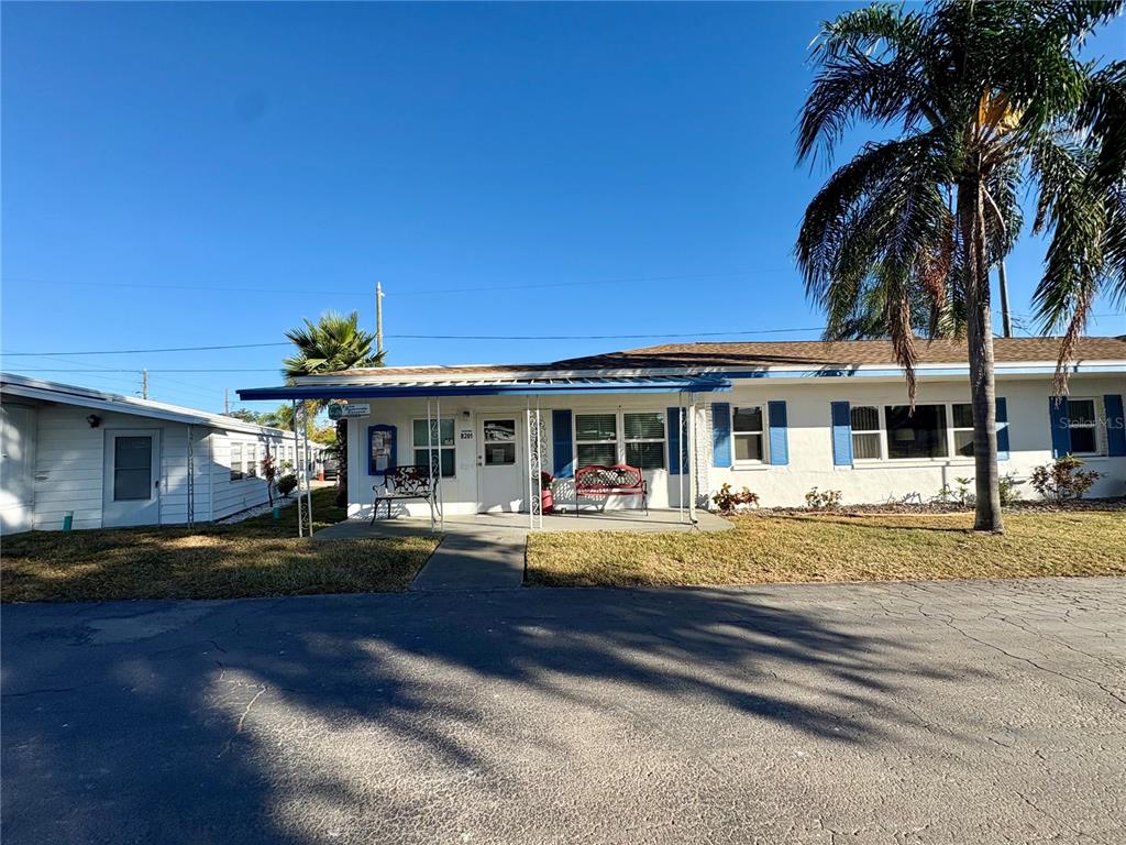 440 Denice Drive Seminole, FL 33772 - Photo 38 of 40 a view of swimming pool with outdoor seating and house in the background