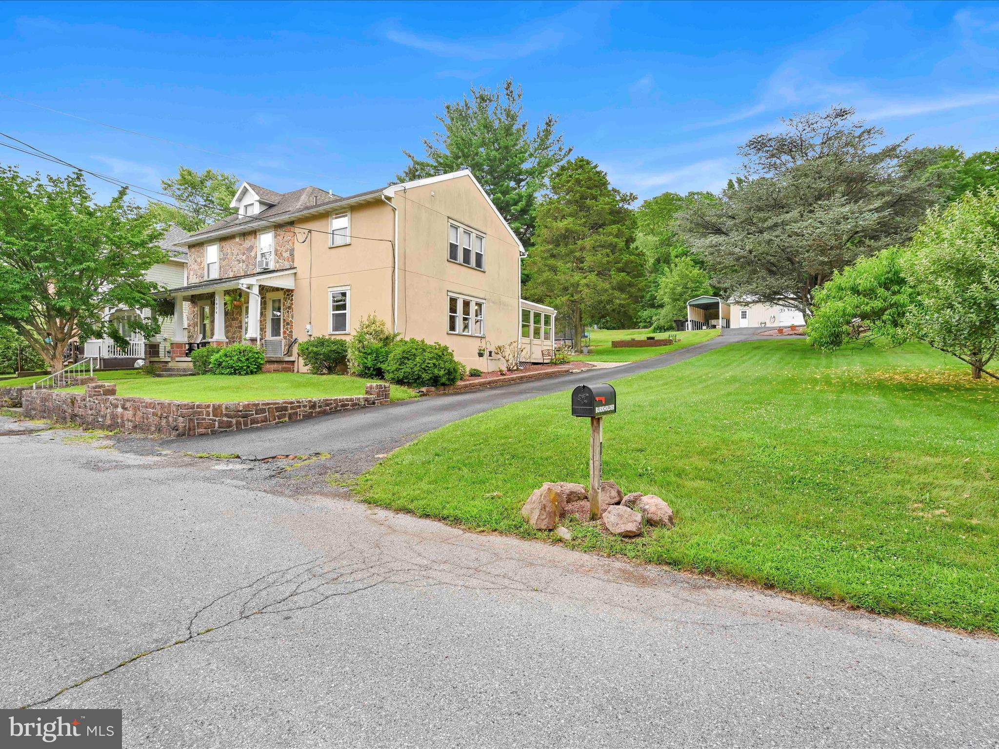 1036 Baker Road Reading, PA 19608 - Photo 2 of 44 a front view of a house with a yard and garage