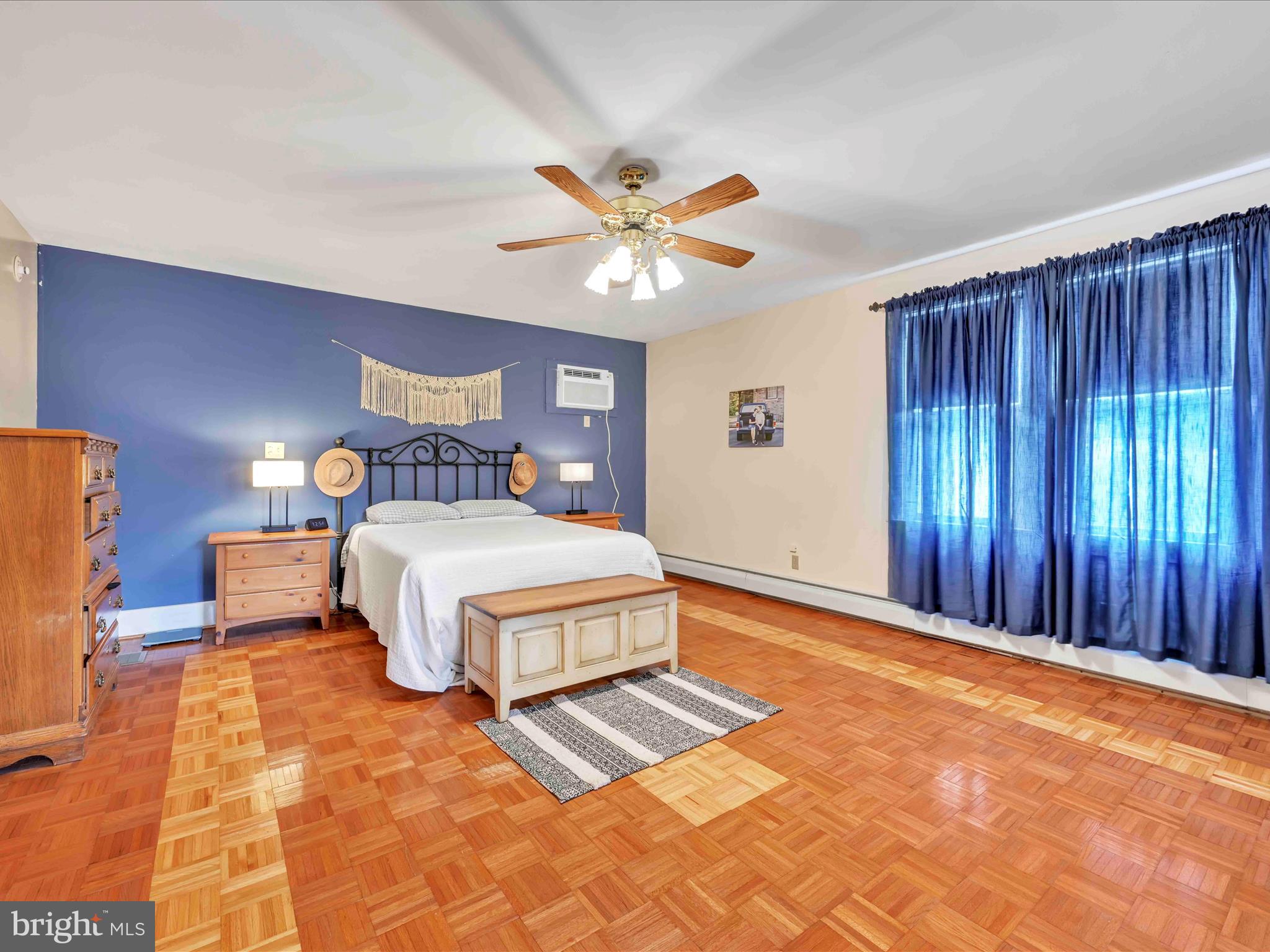 1036 Baker Road Reading, PA 19608 - Photo 21 of 44 a bedroom with a bed and a chandelier