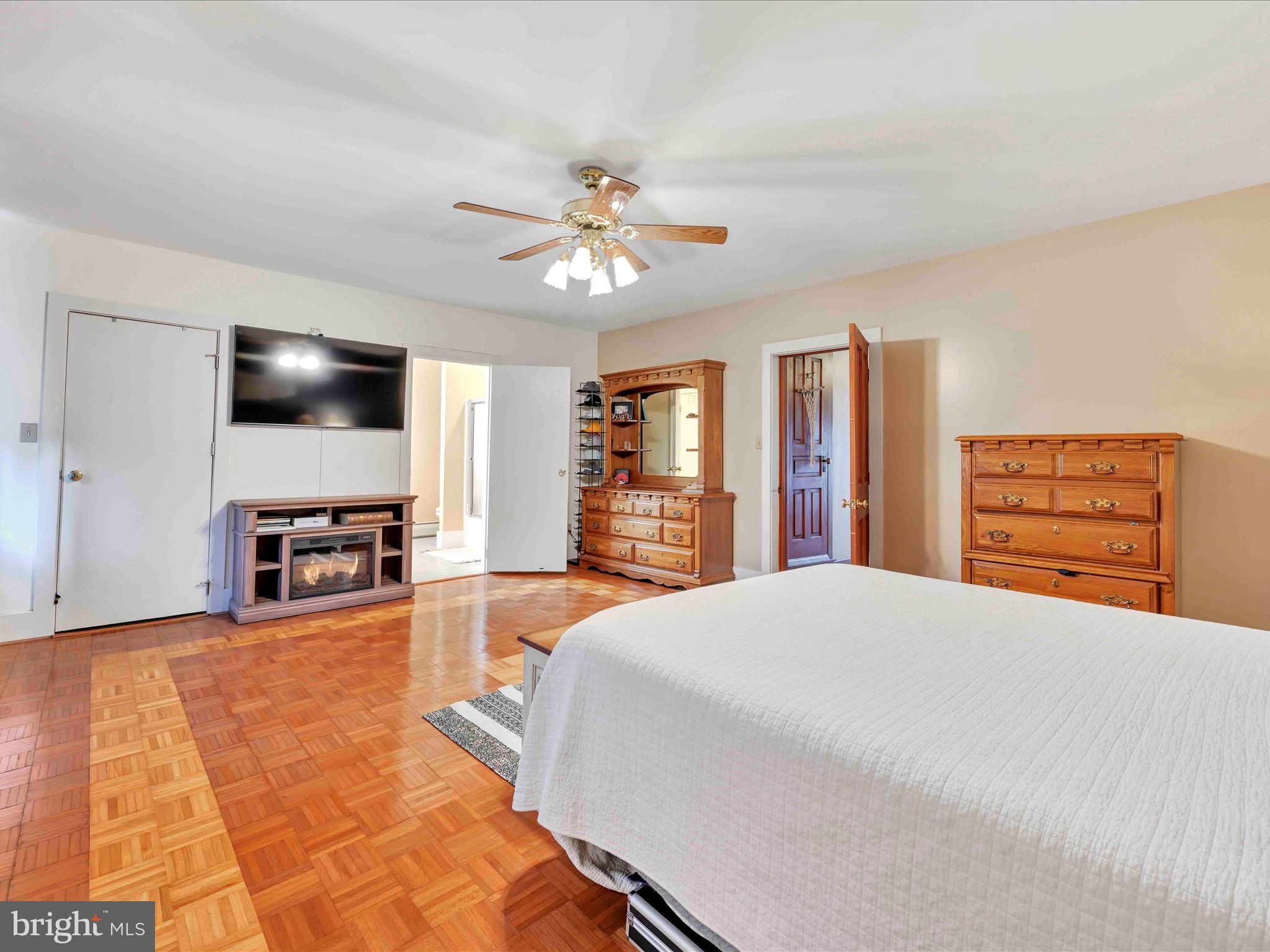1036 Baker Road Reading, PA 19608 - Photo 22 of 44 a spacious bedroom with a bed and a flat screen tv