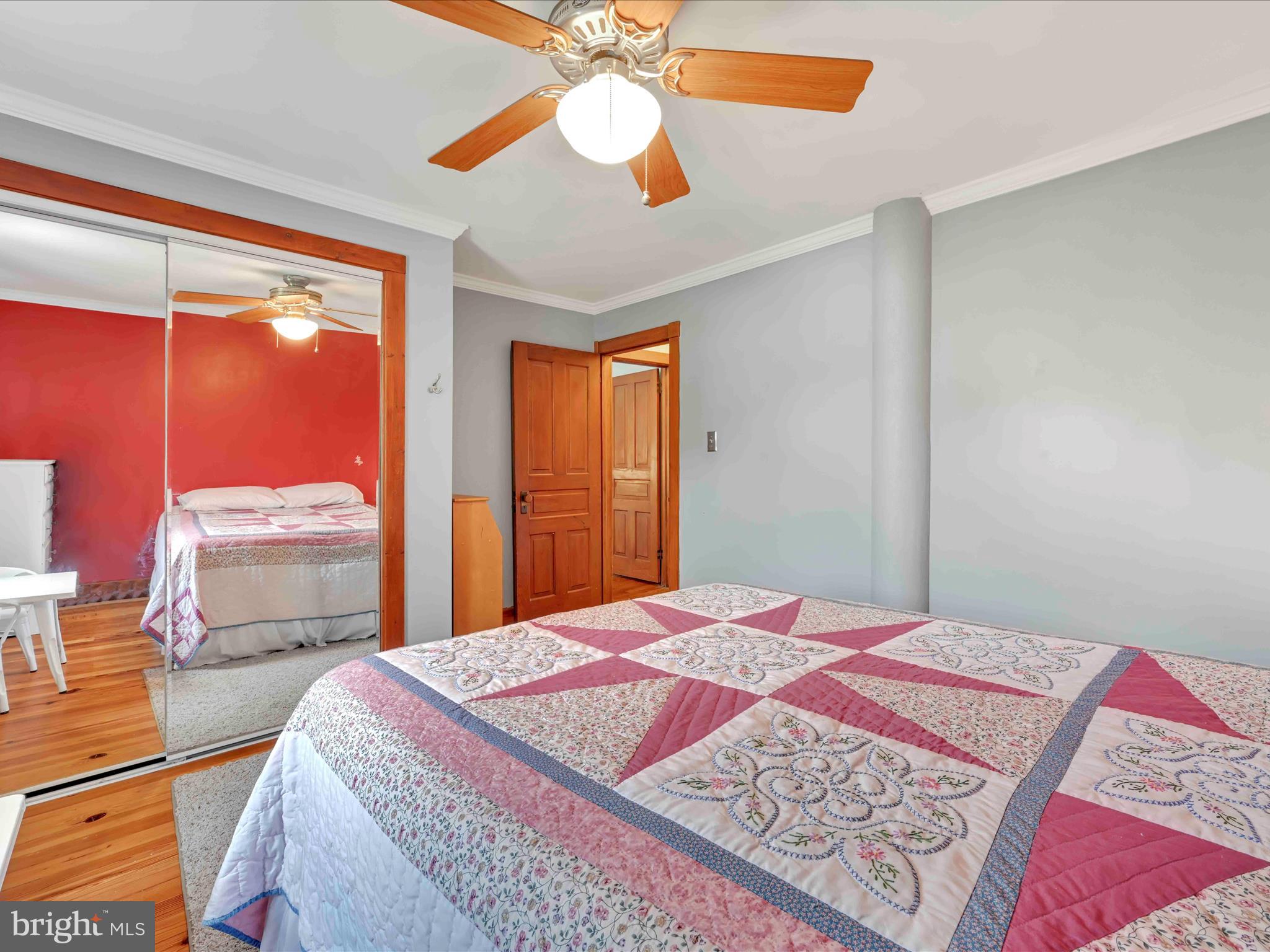 1036 Baker Road Reading, PA 19608 - Photo 25 of 44 a bedroom with a bed and a chandelier