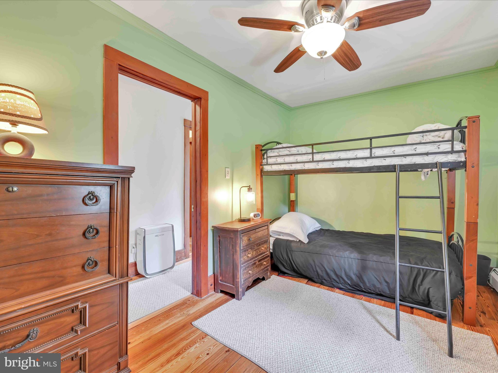 1036 Baker Road Reading, PA 19608 - Photo 29 of 44 a bedroom with a bed and a chandelier
