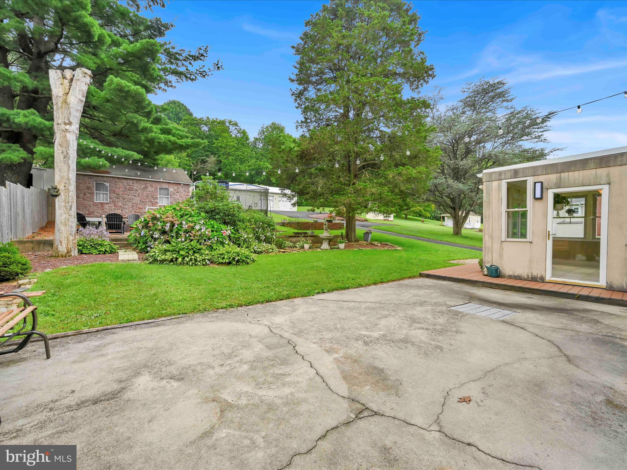 1036 Baker Road Reading, PA 19608 - Photo 30 of 44 a view of a house with a big yard and potted plants