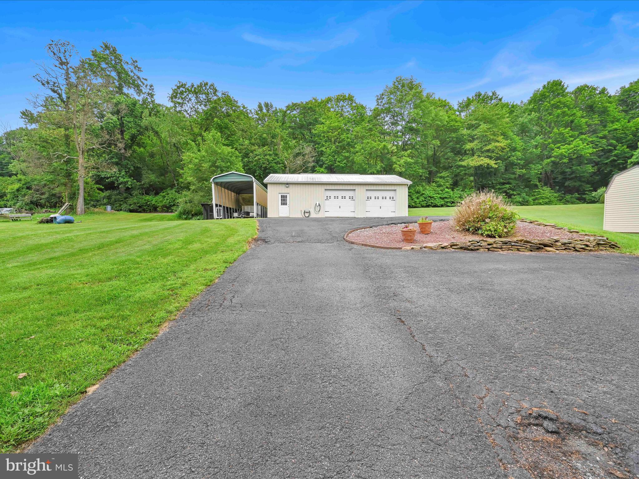 1036 Baker Road Reading, PA 19608 - Photo 34 of 44 front view of a house with a yard and street view