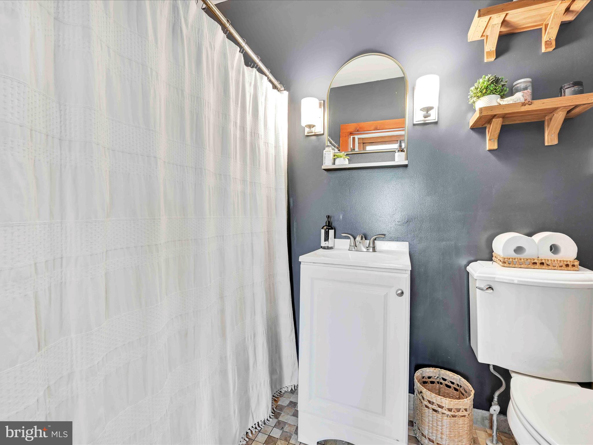 1036 Baker Road Reading, PA 19608 - Photo 6 of 44 a bathroom with a sink a toilet and a window