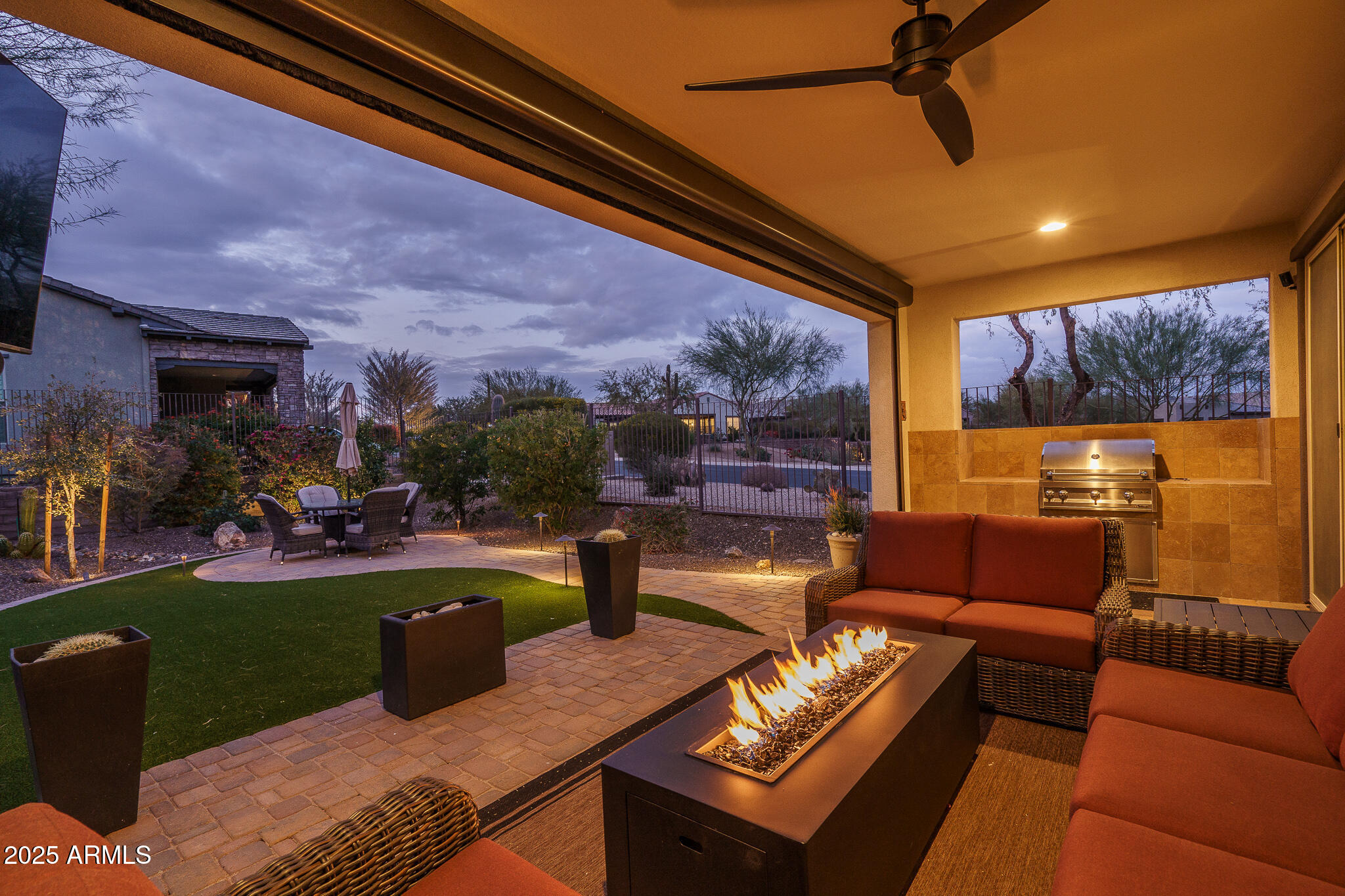 28226 North Crook Court Rio Verde, AZ 85263 - Photo 2 of 28 a living room with furniture and a flat screen tv
